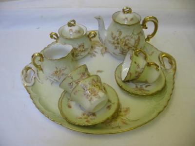 Appraisal: A FRENCH PORCELAIN TETE A TETE gilt printed and painted