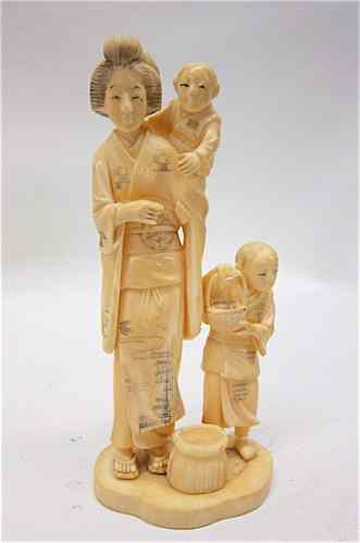 Appraisal: JAPANESE IVORY FIGURAL GROUP mother standing holding a child with