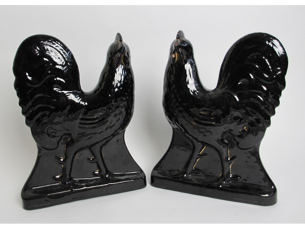 Appraisal: A pair of Fife Pottery black ground cockerels with gilt