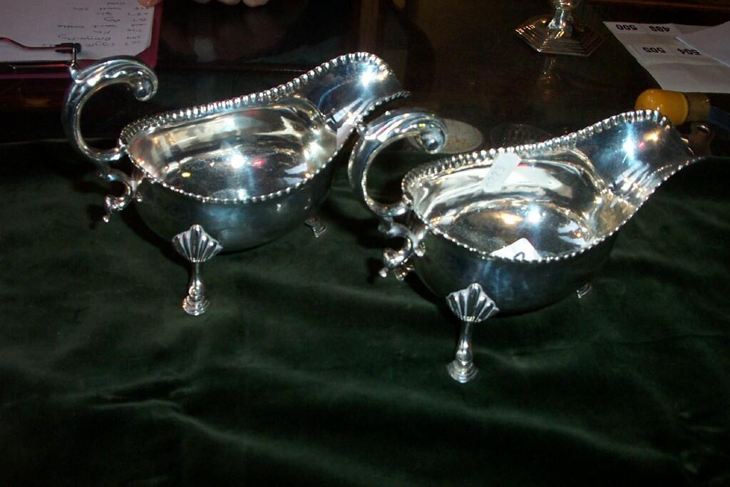 Appraisal: A pair of Georgian silver sauce boats with crimped borders