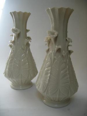 Appraisal: A PAIR OF SECOND PERIOD BELLEEK GLAZED PARIAN NILE VASES