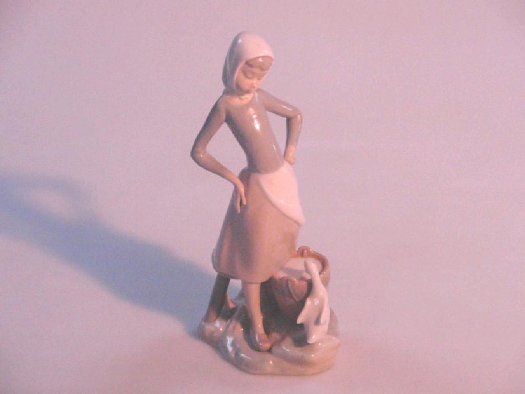 Appraisal: A Lladro figure of a country girl with a duck