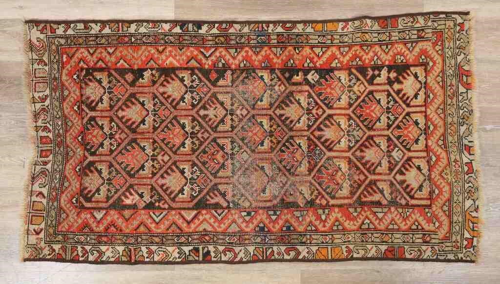 Appraisal: Caucasian style rug th century Fringed edges with field of