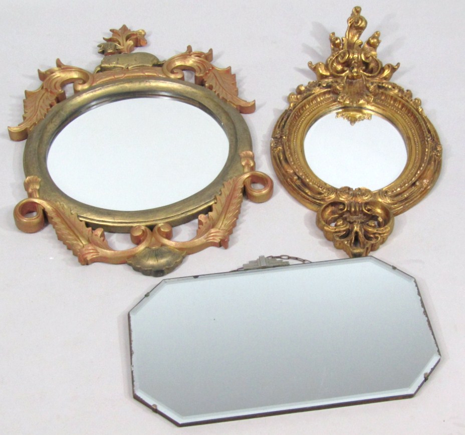 Appraisal: A thC rococo design wall mirror the oval glass in