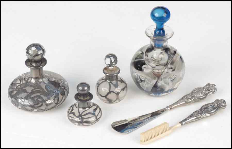 Appraisal: THREE SILVER OVERLAY SCENT BOTTLES Together with a contemporary glass