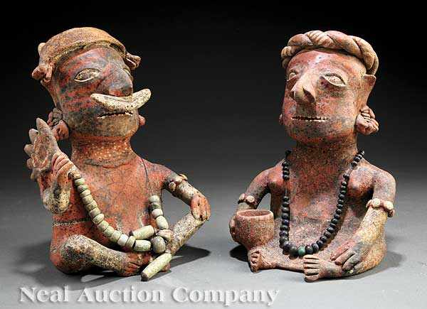 Appraisal: A Pre-Columbian Pottery Couple Nayarit the seated male carrying an