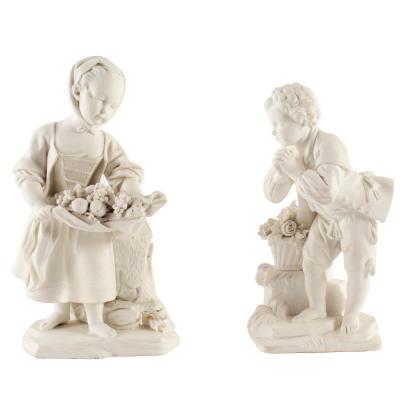 Appraisal: A pair of S vres white biscuit figures of a