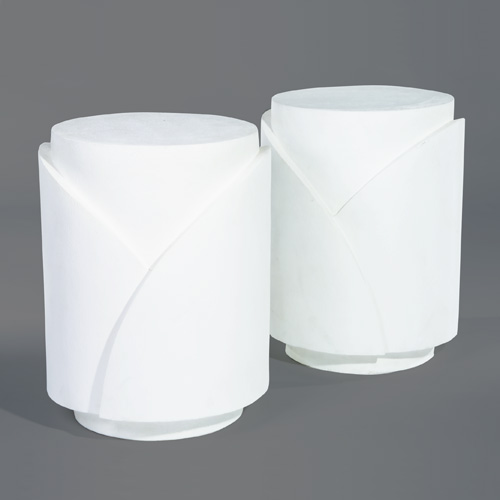 Appraisal: DECORATIVE Pair of white plaster drum-shaped pedestals with overlapping design