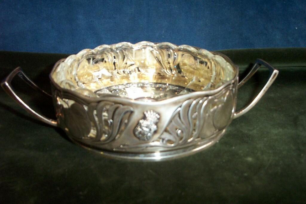 Appraisal: A continental white metal dish holder with pierced and embossed