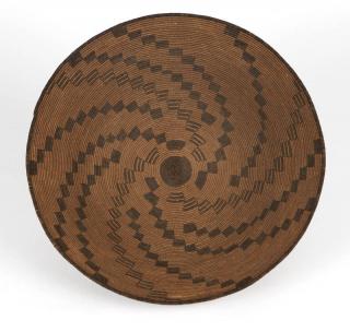 Appraisal: An Apache coiled basketry tray First quarter th century woven