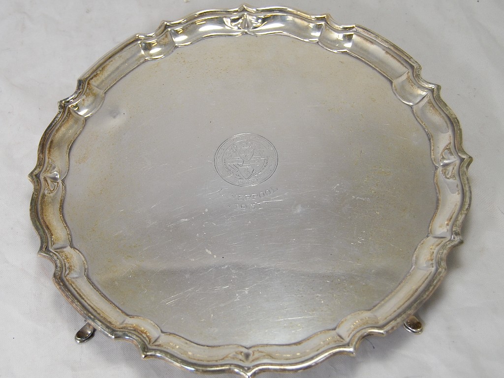 Appraisal: Silver circular salver on four hoof feet bearing crest and