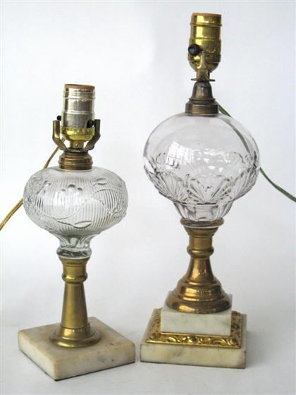 Appraisal: Two pressed glass brass and marble oil lampsEach with globular