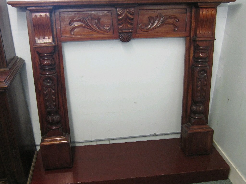 Appraisal: Carved mahogany fire surround