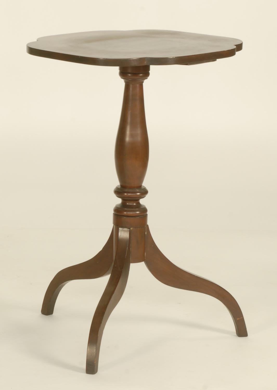 Appraisal: ANTIQUE AMERICAN SHERATON CANDLESTAND in cherry Shaped top Trifid base