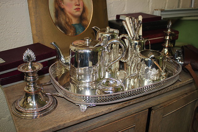 Appraisal: A PAIR OF SILVER PLATE CANDLESTICKS of squat turned form