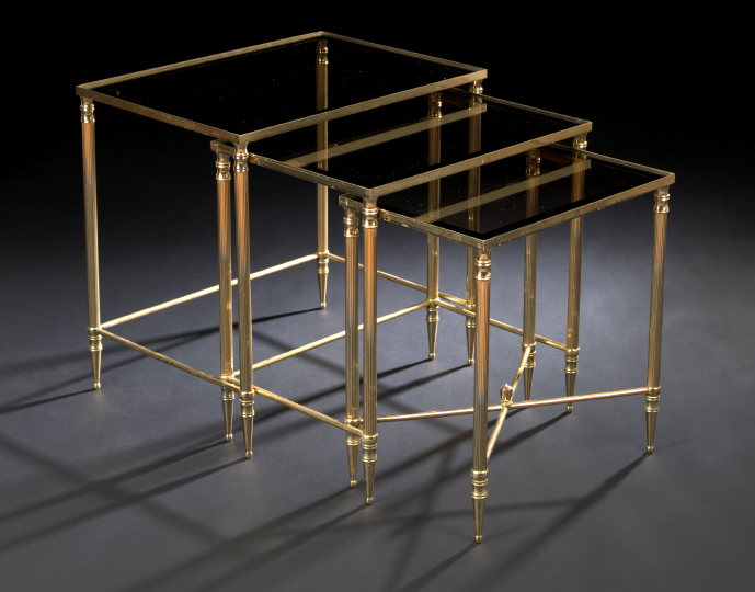 Appraisal: Suite of Three Louis XVI-Style Gilt-Metal and Smoked Glass Nesting