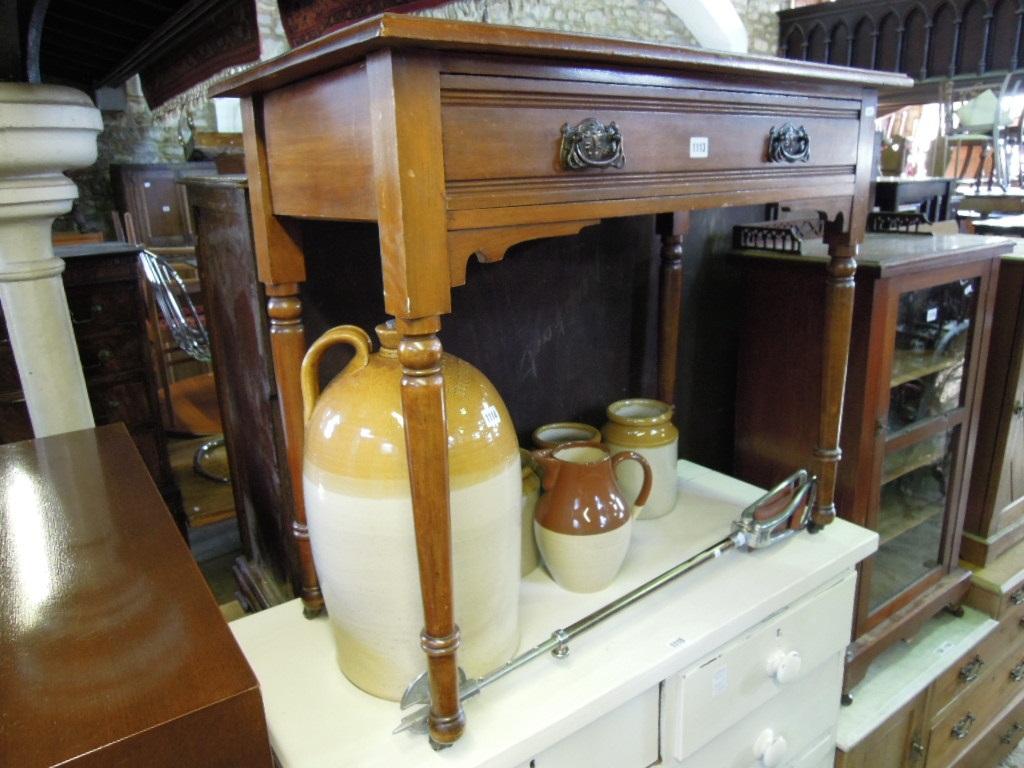 Appraisal: An Edwardian walnut side table fitted with a single frieze