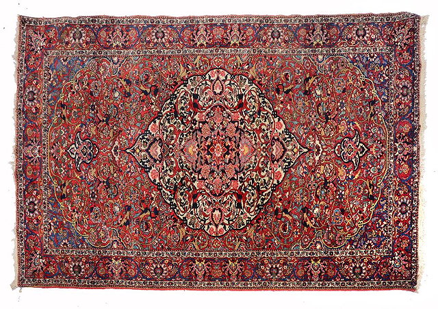 Appraisal: A BAKHTIARI RED GROUND RUG with a central formal white