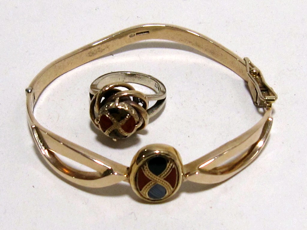 Appraisal: Nine carat yellow gold agate set bangle with similar dress