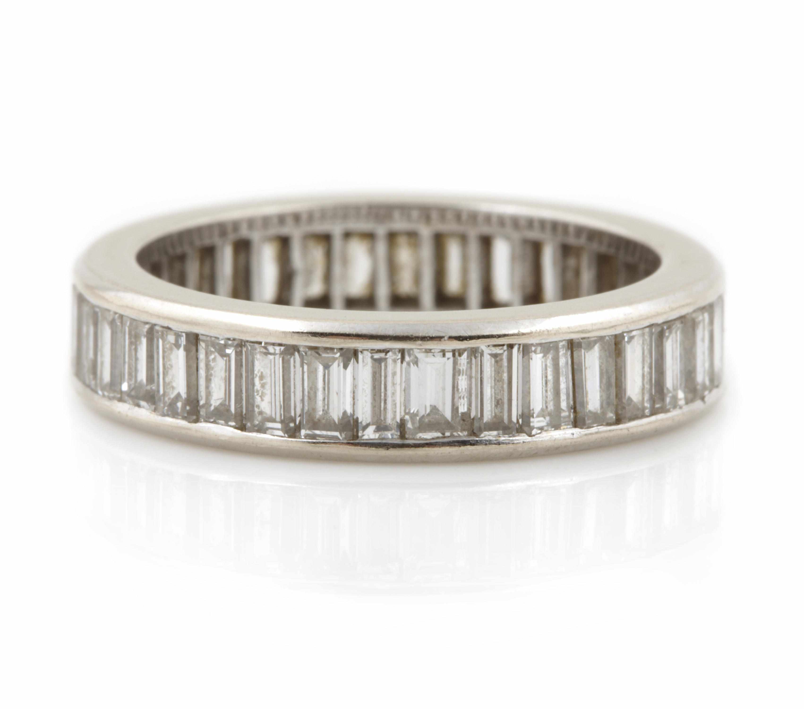 Appraisal: A diamond and platinum eternity band estimated total diamond weight