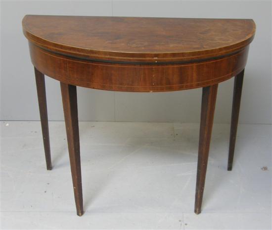 Appraisal: George III mahogany and crossbanded half round folding card table