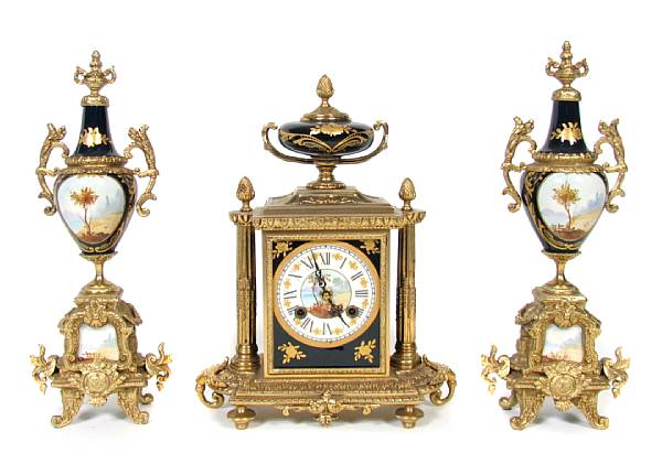 Appraisal: A Louis XVI style gilt metal porcelain clock garniture height