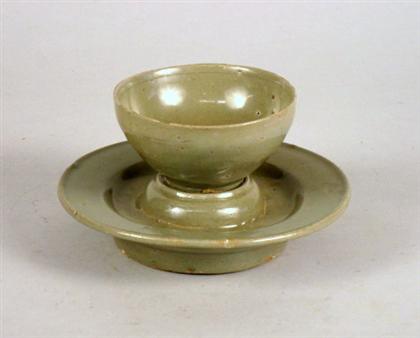 Appraisal: Korean celadon cup and stand Conical cup raised on shallow