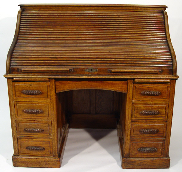 Appraisal: s oak rolltop bureau fitted with an arrangement of nine