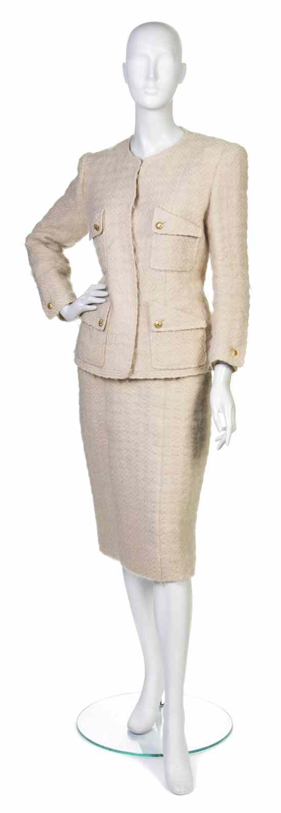 Appraisal: A Chanel Cream Wool Skirt Suit Collection with goldtone logo