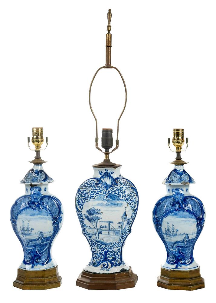 Appraisal: Three Dutch Delft Blue and White Vases as Lamps th