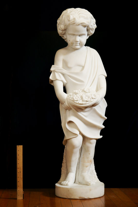 Appraisal: LIFE SIZE CARVED ITALIAN MARBLE SCULPTURE OF A CHILD HOLDING