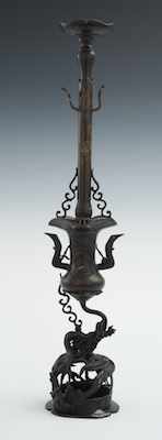 Appraisal: A Chinese Bronze Candlestick Meiji style with warm brown patina