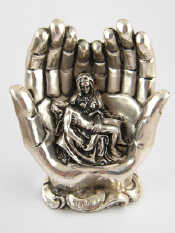 Appraisal: A silver cased Pieta the figures of the Virgin Mary