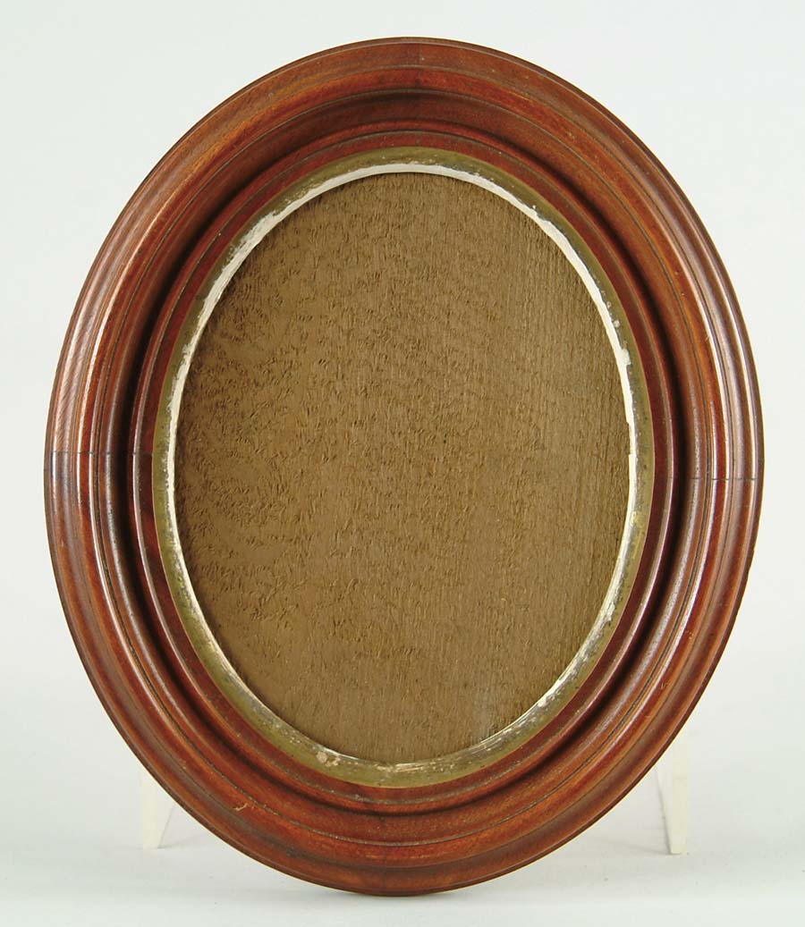 Appraisal: LOT OF FOUR OVAL DEEP WALNUT FRAMES A pair with