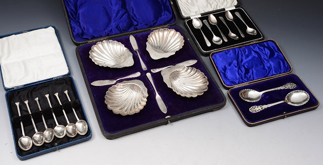 Appraisal: A CASED SET OF FOUR SILVER SCALLOP SHELL SHAPED BUTTER