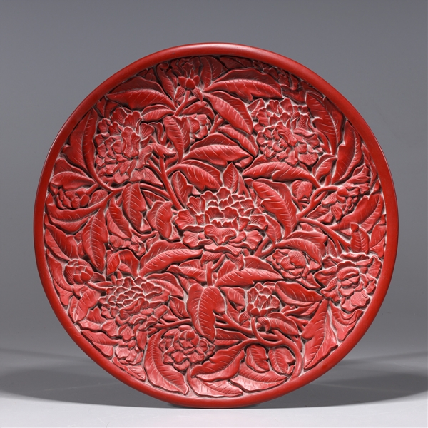 Appraisal: Chinese wooden plate carved in the style of imitation cinnabar