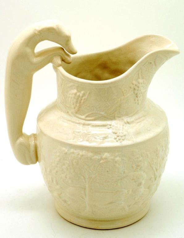 Appraisal: A large molded white body pitcher with hunt scene joined