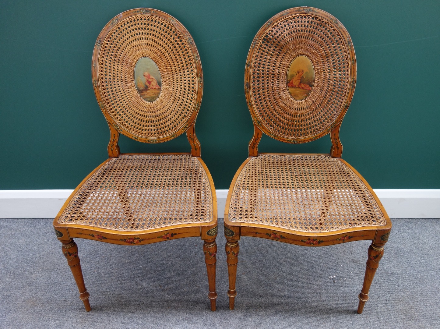 Appraisal: A pair of Sheraton Revival painted satinwood and cane work