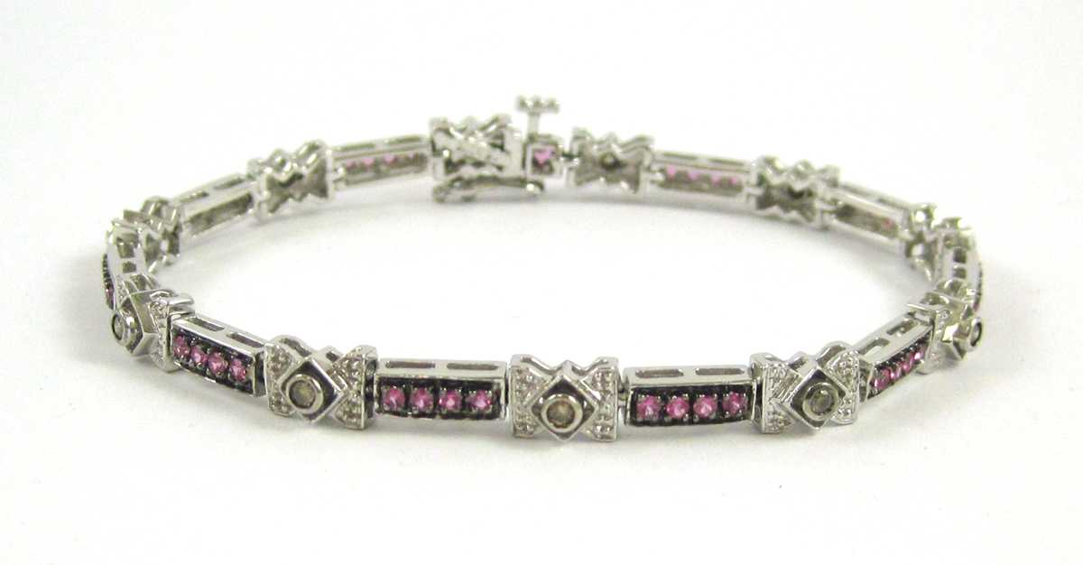 Appraisal: PINK SAPPHIRE AND CHAMPAGNE DIAMOND BRACELET The k white gold