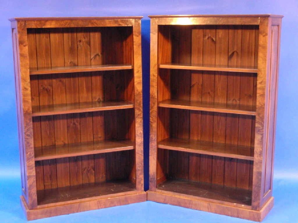 Appraisal: A pair of Victorian style walnut open bookcases with adjustable