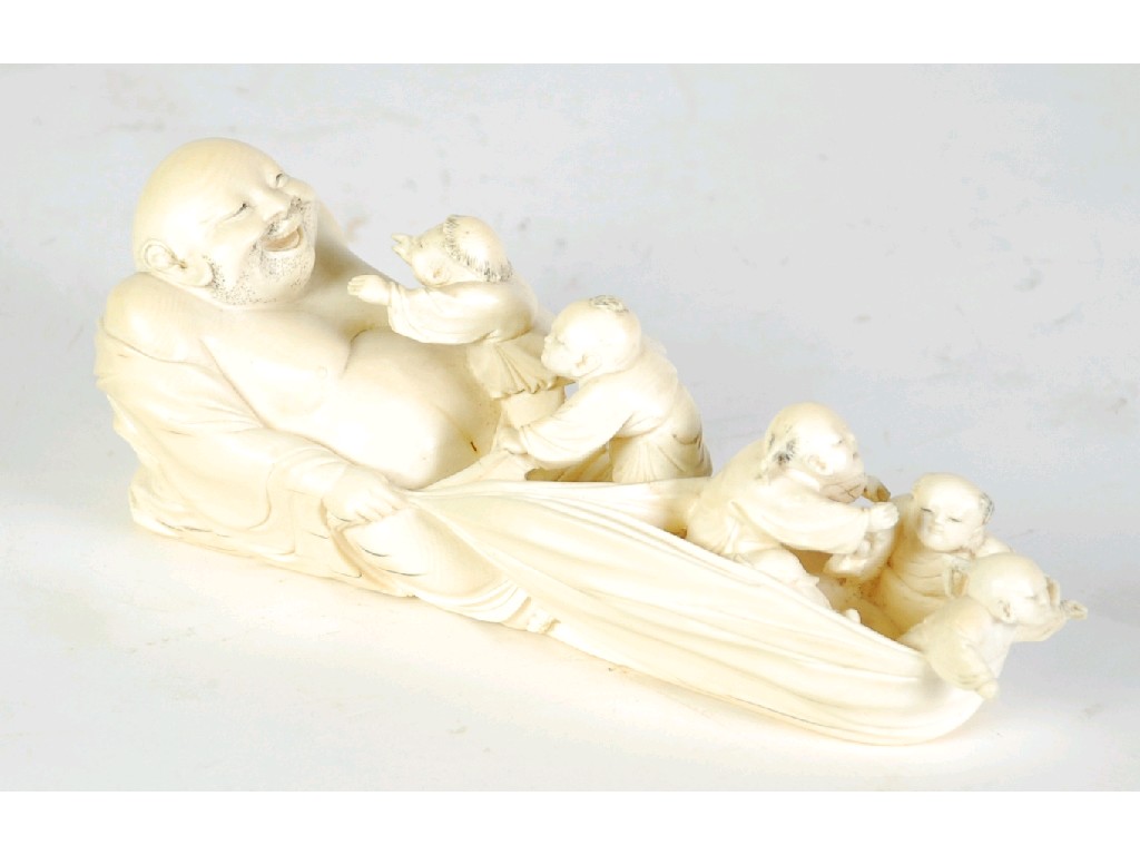 Appraisal: ORIENTAL CARVED IVORY RECLINING FIGURE OF HOTEI with five young