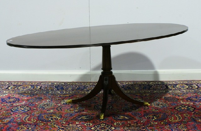 Appraisal: A Regency style elliptical mahogany dining table cm long cm