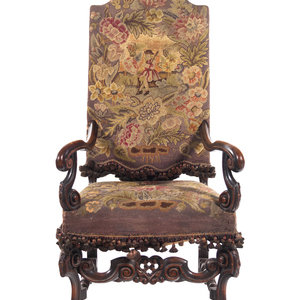 Appraisal: A William and Mary Style Carved Walnut Armchair with Needlepoint