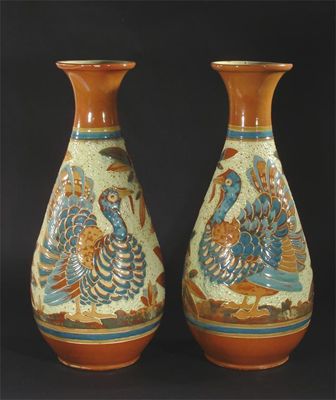 Appraisal: A tall pair of C H Brannam vases incised and