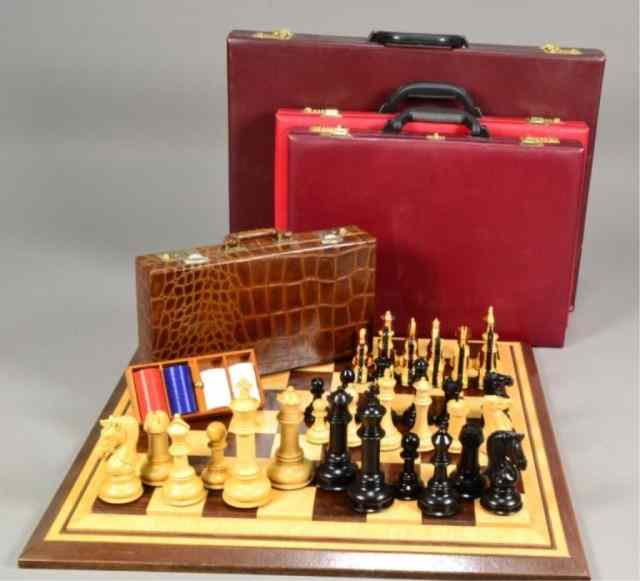 Appraisal: CHESS SETS POKER CHIP CONTAINERIncluding a traditional style weighted black