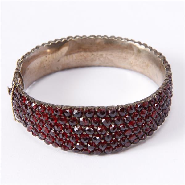 Appraisal: Antique Victorian hinged bangle bracelet with rows of garnets inner