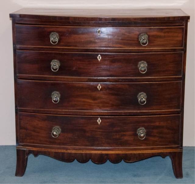 Appraisal: English Sheraton Mahogany Bowfront Chest Four graduated drawers with bone