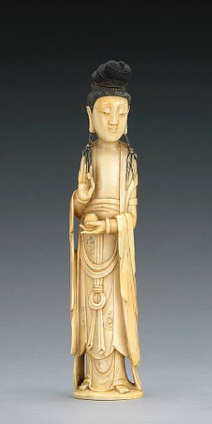 Appraisal: A tinted ivory standing figure Republic Period Portraying Guanyin standing