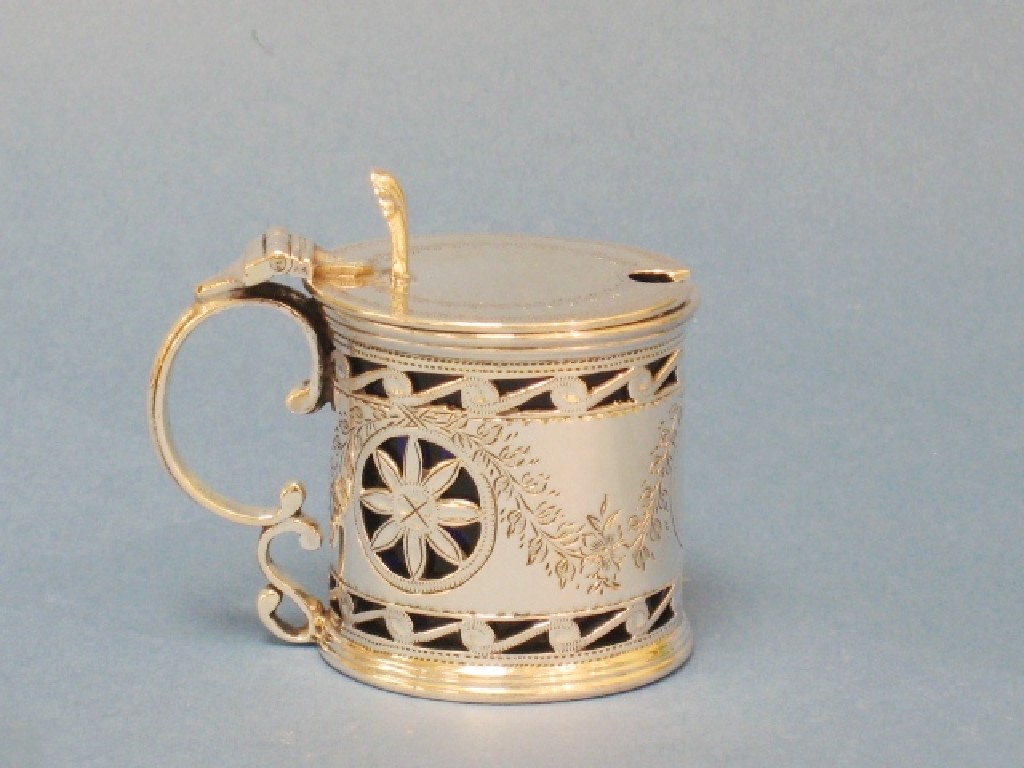 Appraisal: A Victorian pierced circular Mustard Pot with swag and rosette