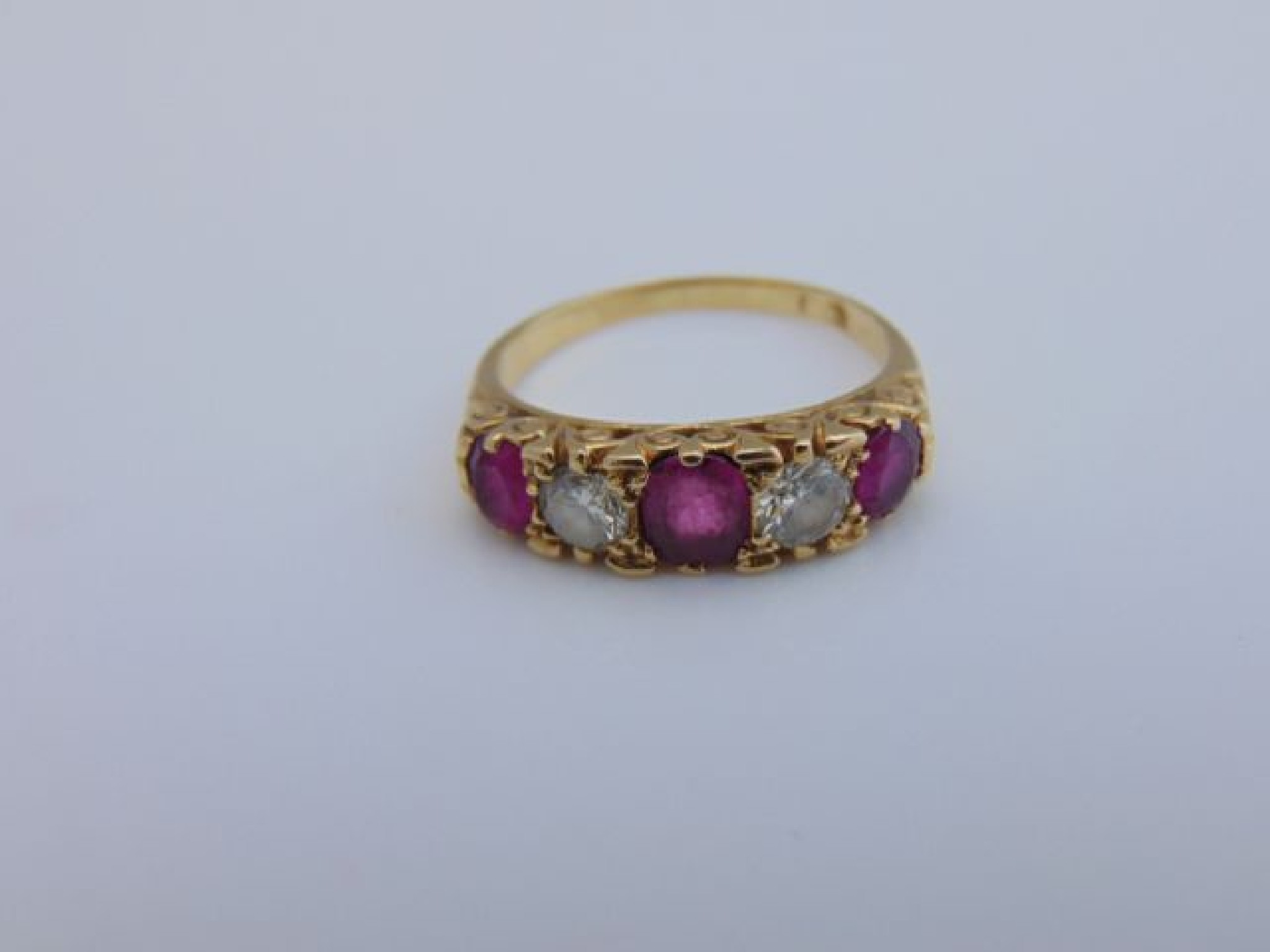 Appraisal: An Edwardian style ruby and diamond ring centred with an